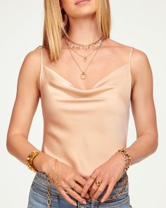 Calling all cami lovers - Abigail was made for you. Frame your figure in this classic top, crafted in the best of satin charmeuse in a rainbow of colors sure to spark joy. Pair with your favorite high waisted denim and a statement necklace and watch this elevated classic take center stage. Size & Fit – This style runs small, we suggest sizing up. – Model is Wearing Size XS– Model is 5'9" Size Guide Details & Care – Dry Clean or Hand Wash– Style #: A0221116 Free Delivery & Easy Returns We offer f Gold Tank Top For Evening, Chic Gold Camisole Tank Top, Satin Finish Camisole For Night Out, Chic Gold Spaghetti Strap Top, Elegant Gold Tank Top For Evening, Elegant Gold Tank Top For Evening Events, Elegant Gold Camisole For Party, Chic Gold Camisole With Spaghetti Straps, Chic Gold Spaghetti Strap Tank Top