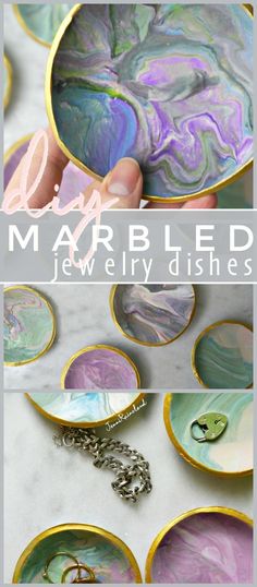 marbled jewelry dishes with gold rims and chains on the bottom, in different colors