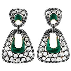 Handcrafted from 18-karat gold & sterling silver, these earring are set with 12.01 carats of rose cut diamonds and 11.4 carats malachite with blackened finish. FOLLOW MEGHNA JEWELS storefront to view the latest collection & exclusive pieces. Meghna Jewels is proudly rated as a Top Seller on 1stDibs with 5 star customer reviews. All items manufactured by us are handmade and can be customized or redesigned. Composition Size-55X35 MM Total Weight-30.5 Gold Weight(Gms)-1.72 Silver Weight(Gms)-24.098 Diamond Wt(Cts)-12.01 Malachite Wt(Cts)-11.4 Luxury Bridal Rose Cut Diamond Drop Earrings, Luxury Hand Set Sterling Silver Diamond Earrings, Luxury Rose Cut Diamond Drop Earrings, Designer Wedding Earrings With Diamond Accents, Luxury Sterling Silver Bridal Earrings With Rose Cut Diamonds, Designer Rose Cut Diamond Jewelry, Designer Diamond Earrings With Diamond Accents, Designer Diamond Drop Earrings, Designer Diamond Earrings With Accents