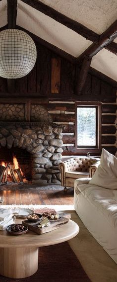 a living room filled with furniture and a fire place