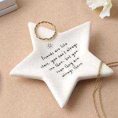 a ceramic star ornament with a quote on it