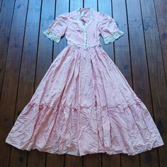 Gunne Sax Size 9 S/M Pink Short Sleeve Full Prairie Vintage Maxi Dress!! Pretty Bubblegum Pink Color. White Cream Ribbon And Lace Details. Pearl Buttons Up The Bust. Princess Cut Waistline. Tiered Ruffle Hem. Extremely Full Skort Half Perfect For Twirling. Ties In The Back To Cinch Waist. There Is A Small Tear At The Hem And A Few On The Back Of One Sleeve. I Also Think The Elastic In The Sleeves Is Loose And Probably Could Be Replaced. Otherwise Wonderful. Happy To Answer Any Questions Measurem Feminine Fitted Victorian Daywear Dress, Feminine Fitted Victorian Dress For Daywear, Feminine Vintage Maxi Dress, Fitted Feminine Victorian Dress For Daywear, Feminine Vintage Dress With Lace Trim And Short Sleeves, Fitted Short Sleeve Maxi Dress With Lace Trim, Fitted Maxi Dress With Lace Trim And Short Sleeves, Pink Short Sleeve Maxi Dress With Lace Trim, Fitted Maxi Length Prairie Dress