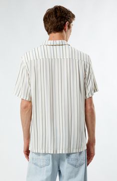 The PacSun Striped Camp Shirt from PacSun is your ticket to easygoing sophistication. Elevate your style with its classic collared neckline and short sleeves, perfect for those sunny days ahead. Crafted from lightweight fabric and eye-catching stripes, it's the ultimate blend of comfort and charm for your summer adventures.


	Collared neckline
	Short sleeves
	Standard fit
	Button closures
	Custom pattern
	100% Rayon
	Machine washable
	Model is wearing size medium
	Model Measurements: 6'1.5” Height, 28” Waist, 32” Inseam Striped V-neck Shirt For Summer, Casual Striped Camp Shirt With Camp Collar, Striped Short Sleeve Shirt With Camp Collar For Spring, Spring Striped Short Sleeve Shirt With Camp Collar, Summer Short Sleeve Camp Shirt With Placket, Striped Short Sleeve Summer Top, Spring Striped Collared Camp Shirt, Summer Striped Short Sleeve Tops, Striped Camp Collar Top With Relaxed Fit