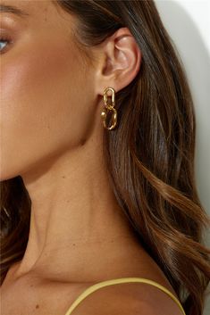 Gold dangle earrings. Polished metal construction. True to size. Stud closures for pierced ears. Please Note: Avoid contact with lotions and perfumes. Bring a little gold to your 'fit with the 18k Gold Plated Everyone Wants Earrings. This style will pair effortlessly with any look, from day to night, you'll find yourself wearing these on repeat. Gold Dangle Earrings, Gold Earrings Dangle, On Repeat, Pierced Ears, Metal Construction, Earrings Gold, Ear Piercings, Women's Earrings, Gold Earrings