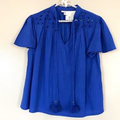 Brand New Knox Rose Top In Royal Blue. Flutter Short Sleeves, Eyelet Detail On Shoulders And Tie Neckline With Tassels. Size Xs. New With Tag. Shoulder To Hem 23 Armpit To Armpit 19.5 55% Cotton 45% Rayon Blue Flutter Sleeve Blouse For Spring, Chic Blue Blouse With Flutter Sleeves, Chic Blue Tops With Flutter Sleeve, Blue Flutter Sleeve Blouse For Brunch, Flutter Sleeve Blue Blouse For Brunch, Red Ruffle Top, Red Floral Top, Flutter Sleeve Blouse, Lacy Tops