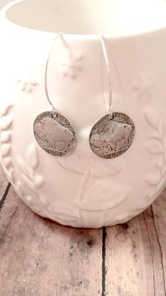 Stunning buffalo coin earrings! The sterling silver plated ear wires measure 1 2/5", and the pewter buffalo charms measure 4/5" x 4/5" (Total length is approximately 2 1/5") All items are lead and nickel free, message with any questions, thanks! Nickel Free Coin Shaped Sterling Silver Earrings, Nickel Free Coin-shaped Sterling Silver Earrings, Nickel Free Sterling Silver Coin Earrings, Nickel-free Sterling Silver Coin Earrings, Nickel-free Coin-shaped Sterling Silver Earrings, Nickel Free Round Pewter Jewelry, Adjustable Stamped Dangle Earrings, Bohemian Sterling Silver Coin Jewelry, Nickel-free Pewter Medallion Jewelry