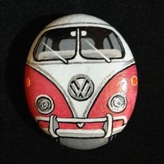 a red and white vw bus painted on a black background