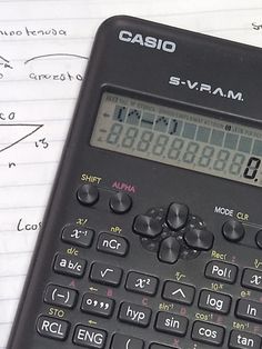 a calculator sitting on top of a piece of paper