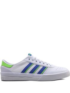 a white and blue adidas sneakers with green accents on the upper half of the shoe