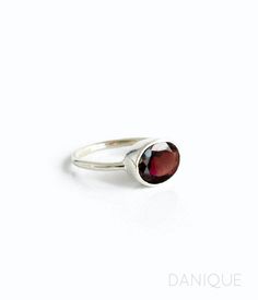 "You'll fall in love with the deep red coloring of this Garnet Quartz ring. This is a perfectly sized oval to compliment any collection. Popular as a birthday gift for those January babes and Garnet lovers alike. This is a dark, transparent red gemstone with no flaws. This stone is beautifully faceted and bezel set in a 925 sterling silver band or plated with 18k vermeil gold. Gemstone is approximately 8 x 12mm. Band has 925 stamp on inside. Please note that each ring is handmade and there may b Red Birthstone Ring With Round Stone For Gift, Garnet Ring With Bezel Setting As Gift, Garnet Bezel Setting Ring As A Gift, Faceted Ruby Ring As A Gift, Garnet Ring With Bezel Setting For Gift, Jewelry Stacking, January Birthstone Jewelry, January Birthstone Rings, Gold Vermeil Jewelry