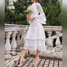 Gorgeous Floral Embroidered Lace Layered Dress White * Long Sheer Lace Sleeve * High Banded Neckline * Tiered Bell Sleeve & Hem * Back Zip * High Waist * Midi Length Skirt *Approximate Unstretched Measurements* Xs 2 *Bust 34" *Waist 26.25" * Hip 36.5" *Sleeve Length 26" *Length 45.25" Small 4 *Bust 35.25" *Waist 28" * Hip 38.25" *Sleeve Length 26.25" *Length 46" Medium 6 *Bust 37" *Waist 29.25" * Hip 39.75" *Sleeve Length 27" * Length 47" Large 8 /10 *Bust 39.25" *Waist 32" * Hip 42" *Sleeve Len Floral Embroidered Midi Lace Dress For Wedding, Lace Embroidered Midi Dress For Wedding, Wedding Lace Embroidered Midi Dress, Embroidered Midi Lace Dress For Wedding, Embroidered Lace Midi Dress For Wedding, Elegant Embroidered Lace Dress For Garden Party, Elegant Lace Embroidered Dress For Garden Party, Elegant Midi Embroidered Dress With Lace Trim, Midi Length Wedding Dress With Lace Work