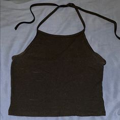 This Brandy Melville Halter Top Is Super Soft And Has Strings That Tie Around The Neck. Only Worn A Couple Times. It’s Cropped But Not Too Cropped. Looks Brand New Black Stretch Halter Neck Top, Trendy Black Halter Neck Tops, Black Fitted Halter Neck Top, Fitted Black Halter Neck Top, Casual Black Stretch Halter Top, Casual Black Halter Top For Party, Casual Black Halter Crop Top, Black Cotton Halter Neck Top, Cotton Halter Neck Top For Night Out