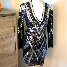 Express Sequin Mini Dress In Silver. Mesh Long Sleeves. Size Xs. New With Tags. No Damages, Lose Sequins Or Tears. Bust: 31.5-32.5" Waist: 24-25" Hips: 35-36" Silver Long Sleeve Embellished Mini Dress, Metallic Long Sleeve Sequin Mini Dress, Silver Embellished V-neck Mini Dress, Metallic V-neck Mini Dress With Sequins, Black Zebra Print V-neck Dress, Mesh Long Sleeve, Silver Sequin, Express Dresses, Sequin Mini Dress