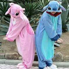 two people in pajamas are standing next to each other and one is wearing an animal costume