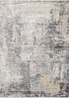 an abstract rug with grey and yellow tones