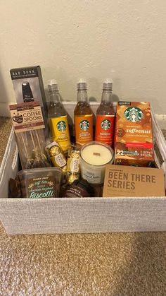 the starbucks coffee gift box is packed with drinks, snacks, and other goodies