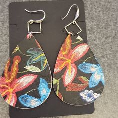 Faux Leather Drop Earrings Floral Design Floral Design Varies On Each Earring Lightweight Length: Approximately 3' Spring Adjustable Teardrop Earrings, Adjustable Teardrop Flower Earrings, Casual Multicolor Teardrop Earrings, Multicolor Teardrop Earrings For Spring, Multicolor Teardrop Casual Jewelry, Spring Multicolor Teardrop Earrings, Casual Multicolor Teardrop Jewelry, Everyday Multicolor Spring Earrings, Skeleton Earrings