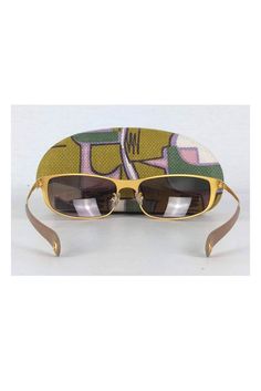 Take these fabulous sunnies everywhere you go! Made with a chic rectangle shaped gold frame with brown gradient lenses. Gold frames Brown gradient lens Made in Italy Rectangle frames Leather trim on arms Comes w/ case & cloth Very light marks on frame Lens width 2.75" Lens height 1.5" Chic Gold Wayfarer Sunglasses, Designer Gold Polarized Sunglasses, Designer Gold Rectangular Sunglasses, Gold Sunglasses With Gradient Lenses For Travel, Trendy Gold Wayfarer Sunglasses, Gold Rectangular Tinted Sunglasses, Gold Rectangular Sunglasses With Mirrored Lenses, Gold Rectangular Sunglasses With Tinted Lenses, Modern Gold Sunglasses For The Beach