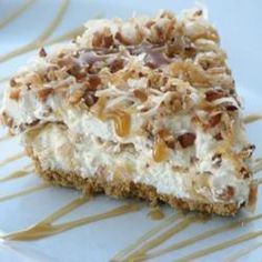 a piece of cheesecake with nuts on top