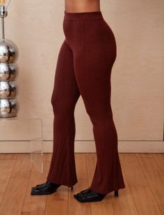 Luxuriate stylishly wearing these cozy flares. A variegated rib texture elevates from a basic silhouette to a lush loungewear staple. Pair it with our Clara Top for a sumptuously coordinated look. HIGH WAISTED LEGGING IN MULTI-RIB PATTERN. Carmen is 5'7” wearing a size S/M Available sizes: S/M, M/L 9% WOOL, 16% ACRYLIC, 20% PTT, 55% NYLON Style# G931 Flare Bottoms For Fall Loungewear, Casual Ribbed Leggings For Fall, Chic Ribbed Flare Bottoms, Trendy Flare Pants For Loungewear, Casual Flare Leggings For Loungewear, Flare Ribbed Pants For Loungewear, Trendy Ribbed Pants For Loungewear, Ribbed Flare Pants For Loungewear, Ribbed Bottoms For Fall