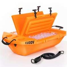 an orange cooler filled with ice and water next to a leash on a white background