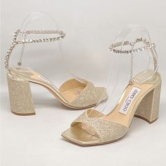 Never Worn With Box And Dust Bag. Size 35.5 Retail For $1150 Made In Italy, These Saeda Glitter Sandals From Jimmy Choo Are Styled With An Open Toe And A Crystal Charms At The Ankle. Open Toe Clasp Closure Textile Upper Leather Sole Made In Italy Block Heel: About 3.25” (85mm) Luxury Glitter Sandals For Formal Occasions, Luxury Formal Sandals With Glitter, Luxury Sparkling Sandals For Gala, Luxury Glitter Sandals With Ankle Strap, Sparkling Block Heel Heels For Gala, Luxury Sparkling Sandals With Ankle Strap, Luxury Sparkling Ankle Strap Sandals, Luxury Open Toe Sparkling Sandals, Luxury Sparkling Open Toe Sandals