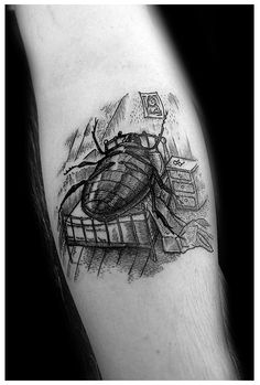 a black and white photo of a bug on the arm