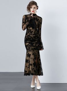 Mystique becomes tangible in this delicately crafted black lace dress that exudes both elegance and sensuality. A sheer overlay with intricate floral patterning cascades over a sleek, form-fitting underlay, creating a dance between concealment and revelation. The full-length sleeves bloom into fluted cuffs, adding a touch of dramatic flair, while the high neckline balances the ensemble with a touch of traditional grace. Perfect for gala events or sophisticated soirées, this dress demands attenti Black Lace Gown, Sleeveless Dresses Casual, Push Up Swimsuit, Gala Events, Printed Tankini, Sheer Overlay, Black Lace Dress, Pink Midi Dress, White Maxi