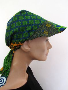 Women's Sun Hat, Chemo Headwear, Sun visor. I designed this headwrap sun visor hat as I needed one to carry with me during my summer holidays and the outcome was this visor which I made out of African wax fabric (of course) It became so popular among my friends as they all liked it so much as it is so light and flexible and you can keep it in its matching container bag in your bag or backpack You will receive the Sun Visor (picture) with its container small  bag 3 great ways of wearing this viso Green Cotton Hat One Size, Fitted Green Cotton Hat, Adjustable Scarf Headwrap For Beach, Casual Green Adjustable Bonnet, Adjustable Green Bonnet Cap, Casual Green Headwrap One Size Fits Most, Casual Green Headwrap One Size, Casual Green Headwrap, Casual Green One Size Headscarf