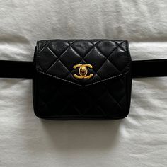 Vintage Chanel Belt Bag Crafted In Black Lambskin Leather With Signature Diamond Quilting, Featuring Original 24k Gold-Plated 'Cc' Turn-Lock On Envelope Front Flap. Belt Fits Sizes Xs-M. Can Be Switched Out For Other Belts Or Worn Across The Chest Pristine Condition Original Belt Included. Dust Bag Included. Features: Adjustable Leather Waist Strap With Buckle 'Cc' Turn-Lock Closure On Pouch Interior Zip Pocket Lambskin Leather Leather Lining Gold Hardware Details: Length: 5.5" (13 Cm) Height: 4 Luxury Pouch-shaped Belt Bag, Luxury Belt Bag Pouch, Vintage Black Bag For Everyday Luxury, Luxury Black Rectangular Belt Bag, Luxury Rectangular Belt Bag With Removable Pouch, Elegant Black Rectangular Belt Bag, Vintage Black Bag With Cc Turnlock Closure, Luxury Black Belt Bag For Formal Occasions, Designer Rectangular Formal Belt Bag