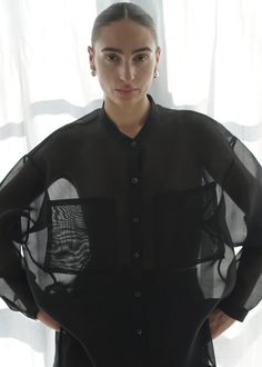 heavy silk organza oversize banded collar button down featuring 2 large front patch pockets, dipped back hemline, button placket and french seams. 100% silk organza. made in the united states. model is 5'7 and wears size small. French Seam, Silk Organza, Vintage Shoes, Black Media, Button Placket, Designer Outfits Woman, Vintage Accessories, The United States, Jumpsuit Dress