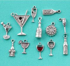 a collection of charms and pendants on a blue background with the words gin written in silver