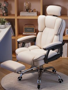 a white office chair sitting in front of a book shelf