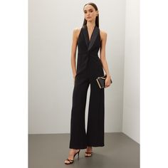 Black crepe (91% Polyester, 9% Elastane). Jumpsuit. Sleeveless. V-neck. Back zipper closure. 60" from shoulder to hemline. 33" inseam. 13" rise. 26.5" leg opening. Imported. Elegant Sleeveless Evening Pantsuit, Elegant Tailored Jumpsuits And Rompers For Party, Elegant Tailored Jumpsuits For Parties, Sleeveless Sleek Evening Pantsuit, Sleeveless Evening Pantsuit For Spring, Elegant Tailored Evening Jumpsuits And Rompers, Chic Tailored Jumpsuits And Rompers For Party, Sleeveless Fitted Cocktail Pantsuit, Fitted Sleeveless Cocktail Pantsuit