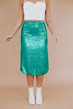 The More Of Glam Sequin Skirt offers a statement-centered look with sequin detailing throughout and an elevating midi length. Display a sleek, polished look in this midi skirt. Waist: High Rise Fabric: 95% Polyester, 5% Spandex; Lining: 100% Polyester Fully sequin design throughout Lined Midi length Imported Fit: True to size MEASUREMENTS: Measured laying flat: 1” stretch throughoutS: WAIST: 26” | LENGTH: 29” | HIPS: 36”M: WAIST: 28” | LENGTH: 29” | HIPS: 38”L: WAIST: 30” | LENGTH: 29 1/2” | HIP Sequin Design, Vip Group, Everyday Chic, Sequin Top, Bottom Clothes, Displaying Collections, Chic Boutique, Polished Look, Classic Shirt