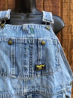 Vintage Osh Kosh overalls. Tag unreadable - estimated size medium but please check measurements as this is only an estimate. Condition - has some staining and wear near knees - see last two photos.  Measurements taken across front laid flat 19" across waist 22" across hip 14" rise 27" inseam - hemmed shorter - could be let out an inch Vintage Bib Front Medium Wash Bottoms, Vintage Denim Bib Front Shortalls, Vintage Denim Blue Bib Front Overalls, Vintage Oshkosh Overalls, Oshkosh Overalls, Non-stretch Blue Denim Overalls, Bib Overalls, Denim Overalls, Overalls