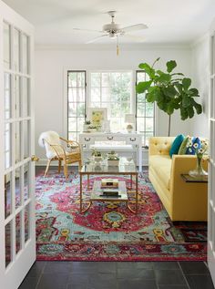 a living room filled with furniture and a rug