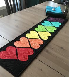 a long table runner with hearts on it