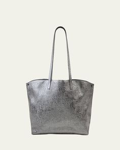 Akris metallic shoulder bag in hammered leather. Approx. 18.50"H x 12.20"W x 5.12"D; 11.42" drop. Two flat shoulder straps. Open top. Folded sides secure at turnlock front. Interior, two zip pockets. "AI" is imported. Formal Top Handle Shoulder Bag With Grained Texture, Formal Grained Texture Top Handle Shoulder Bag, Chic Formal Shoulder Bag With Grained Texture, Classic Silver Textured Leather Bag, Classic Rectangular Shoulder Bag With Grained Texture, Formal Rectangular Bag With Grained Texture, Formal Rectangular Bags With Grained Texture, Elegant Shoulder Bag With Grained Texture For Everyday, Elegant Everyday Shoulder Bag With Grained Texture