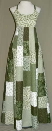 a green and white patchwork dress on a mannequin