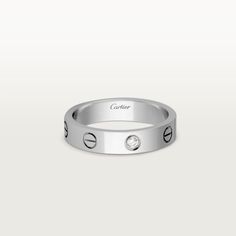 Cartier - LOVE wedding band, 1 diamond - Ring White gold/Diamond - LOVE wedding band, 18K white gold (750/1000), set with 1 brilliant-cut diamond totaling 0.02 carats. Width: 4 mm (for size 52). Please note that the carat weight, number of stones and product dimensions will vary based on the size of the creation you order. For detailed information please contact us. Cartier White Diamond Ring With Accents, White Cartier Diamond Ring With Accents, Cartier Diamond Jewelry With Round Band, Cartier Diamond White Ring With Diamond Accents, Cartier Anniversary Diamond Cut Ring, Cartier Wedding Diamond Ring Vvs Clarity, Cartier White Gold Promise Jewelry, Cartier Wedding Diamond Ring With Vvs Clarity, Cartier Diamond Ring With Round Band