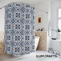 a blue and white shower curtain in a bathroom next to a bathtub with the words illuminate your world written on it