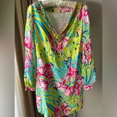 Lilly Pulitzer Saemus Silk Tunic Dress In Schooner Blue Land Escape Print. Beading Around The V-Neckline. Sheer Silk Chiffon Sleeves. Body Fully Lined. Hidden Side Zipper. Tunic Design Allows For A Flowy Fit. 1 Button Gathered Sleeve. No Missing Beads Or Jewels. Worn Only Once As A Bridal Shower Guest. Perfect Dress For So Many Occasions! Retail $299. Size 6 This Dress Is Perfect For Your Trip To Your Favorite Resort. Would Also Look Fabulous For That Upcoming Mixer At Your Sorority. Wear This T Long Sleeve Sequined Beach Dress, Summer Holiday Embellished Dresses, Green Beaded Dresses For Spring, Spring Green Beaded Dress, Spring Holiday Embellished Dresses, Embellished Dresses For Vacation In Spring, Spring Beach Beaded Dress, Beaded Dresses For Vacation, Spring Vacation Beaded Dresses