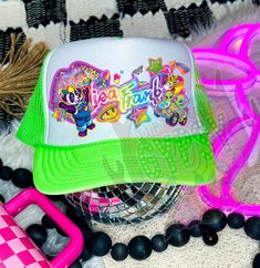 Lisa Frank Trucker Patch hats NOW AVAILABLE As much as I talked about this I really hope you guys love them. Recently I fell head over heels in love with the new over the top trucker hat trend but when I went to find myself a Lisa frank one they DID NOT EXIST 😱 So....I decided to be the one to start them. These are available in multiple colors, with or without a chain, and even sublimation or patches depending on your price range. Get yourself a premade hat or customize your own! The options ar Green Fun Snapback Trucker Hat, Fun Snapback Hat For Streetwear, Fun Green Snapback Trucker Hat, Green Snapback Trucker Hat, Fun Style, Fun Trucker Hat For Streetwear, Fun Flat Bill Trucker Hat For Streetwear, Fun Snapback Trucker Hat, Fun Green Snapback Hat, Fun Flat Bill Hats For Spring