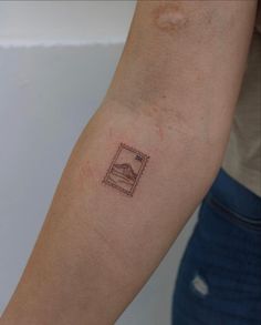 a person with a small tattoo on their arm