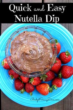 a blue plate topped with chocolate and strawberries next to a bowl of nutella dip