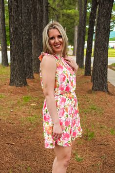 Nothing more rare than a dress that is comfortable AND looks amazing on you! This Rare Love Floral Dress is exactly that! From the bright floral print to the elastic waist and faux halter looking dress. This dress screams summer go to and we are 100% on board with it! Anna is 5'6 and is wearing a size small. Flirty Halter Dress For Spring Vacation, Summer Beach Sundress With Elastic Waistband, Pink Halter Dress For Spring Vacation, Pink Halter Dress For Spring Garden Party, Pink Halter Dress For Garden Party In Spring, Summer Floral Print Halter Dress For Garden Party, Flowy Floral Print Halter Dress For Garden Party, Feminine Floral Print Halter Dress For Spring, Summer Halter Dress With Floral Print For Garden Party