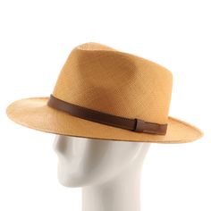 ↑ Click above to watch the video! ↑ Malta Sienna is a modern fedora with a tall hand-blocked teardrop crown that features a stiffened medium brim, sleek leather strap hatband, and beautiful sienna-colored straw. The brim contains a wire to hold its shape. This item is a genuine Panama Hat handwoven in Ecuador. Material: 100% Toquilla StrawBrim: 2 3/4"Crown: 4 1/2" teardropHatband: 5/8" leatherClimate: Sun Handwoven in Ecuador. Hand-finished in the US. Measurements are approximate, this is a hand Modern Fedora With Short Brim For Everyday, Everyday Leather Fedora With Curved Brim, Classic Leather Fedora With Flat Brim, Modern Adjustable Brimmed Fedora, Adjustable Leather Fedora With Short Brim, Brown Short Brim Fedora In Toquilla Straw, Brown Fedora With Short Brim In Toquilla Straw, Brown Fedora In Toquilla Straw With Short Brim, Brown Toquilla Straw Fedora With Short Brim