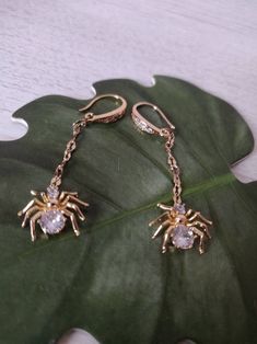 Cute gold spider earrings will make the perfect gift for friend or just go ahead and treat yourself. Made with love for you. Gold Novelty Jewelry For Party, Novelty Gold Jewelry Gift, Dangle Earrings As Halloween Gift, Dangle Earrings For Halloween Gift, Halloween Gift Drop Earrings Jewelry, Novelty Drop Earrings For Party, Halloween Gift Drop Earrings, Novelty Gold Earrings, Gold Novelty Dangle Jewelry