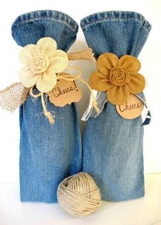 two blue jeans with flowers and twine on them